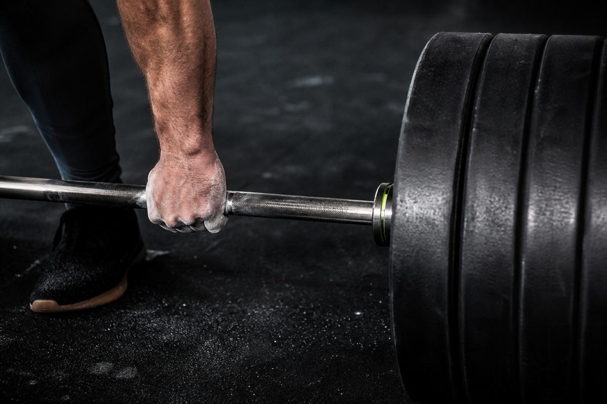 Barbell and plates on a gym floor